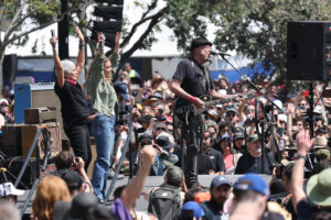 US singer-songwriters Maggie Rogers (2-L) and Joan Baez (L) perform with Canadian-American singer-songwriter Neil Young (R) at the 'Fighting Oligarchy Tour' rally at Grand Park in Los Angeles, California, USA, 12 April 2025. Thousands of people attended the rally to show support for US Senator Bernie Sanders and US Representative Alexandria Ocasio-Cortez. Bernie Sanders and Alexandria Ocasio-Cortez lead 'Fighting Oligarchy' rally in Los Angeles, USA - 12 Apr 2025