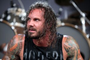 As I Lay Dying - Tim Lambesis Rockstar Energy Drink Mayhem Festival, Tampa, Florida, America - 13 Jul 2012 Lead singer of the metal band As I Lay Dying was arrested Tuesday and charged with attempting to hire a hit man, the San Diego County Sheriff's Department said. Authorities said TIM LAMBESIS tried to contract an undercover detective to kill his estranged wife. He is charged with solicitation of another to commit murder.