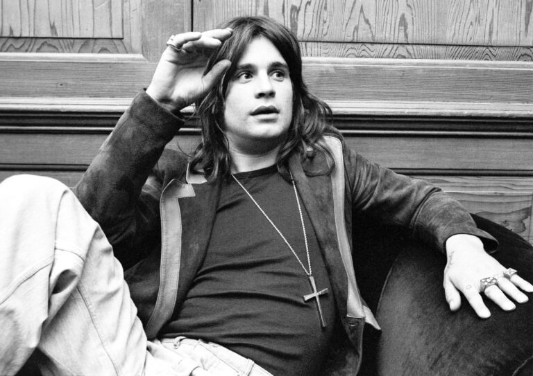 Ozzy Osbourne, debating the merits of Black Sabbath's new album 'Sabotage' at Bronze Records offices, 1975 Ozzy Osbourne photoshoot, London, UK - 1975