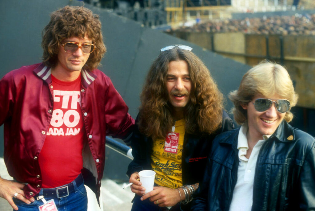 Triumph - Rick Emmett, Mike Levine and Gil Moore in Port Vale - Aug 1981 VARIOUS