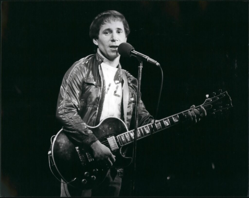 Various Paul Simon in concert in London Various Ten years after splitting from his singing partner Art Garfunkel, American singing star Paul Simon is still an international bestseller. A multi-millionaire who has sold 40 million records in the past 20 years, he has been in London recently to give a series of solo concerts, backed by a band and chorus, For the past four years he has been involved in a film, ''One Trick Pony'' which he wrote and starred in and has now been released in the States. Paul now lives with actress Carrie Fisher, of ''Star Wars'' fame, whilst his eight year old son Marper lives nearby in New York with Pauls ex-wife Peggy.