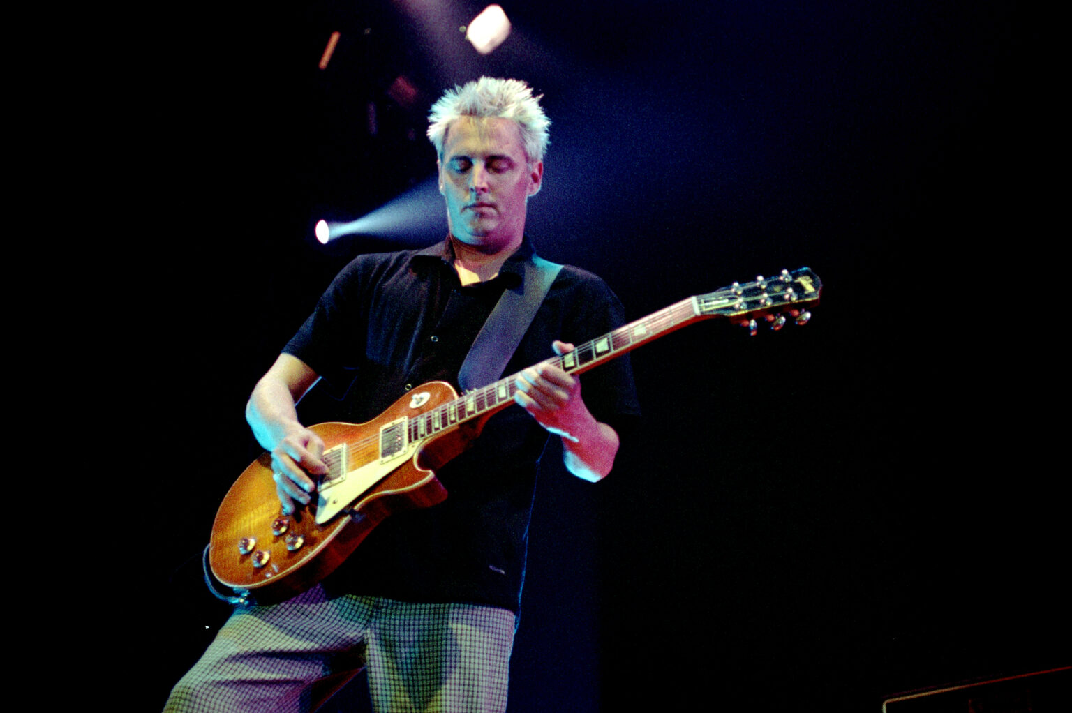 Mike McCready performing live with Pearl Jam on stage.