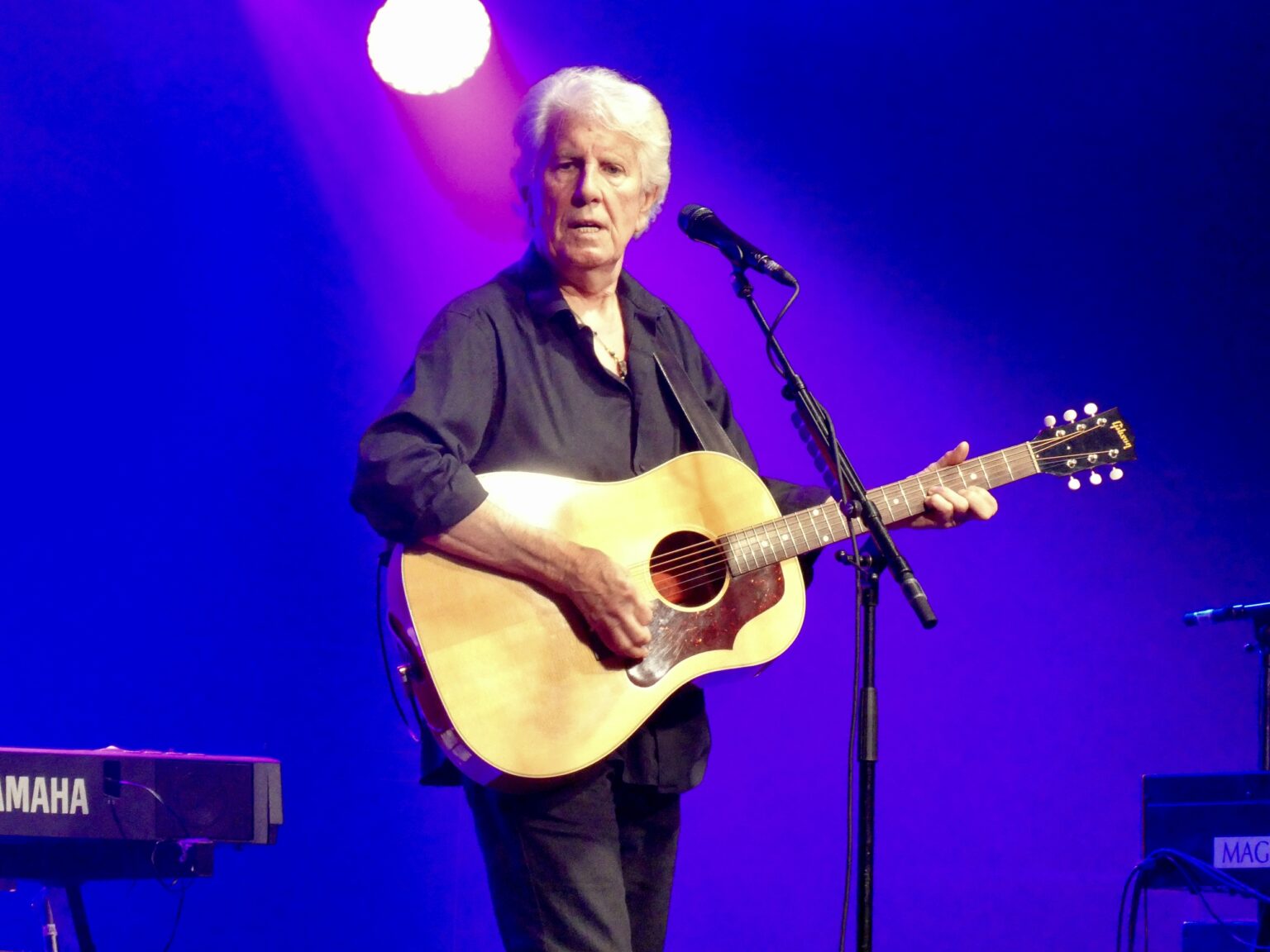 Graham Nash performs live on stage at the 2019 Cambridge Folk Festival.