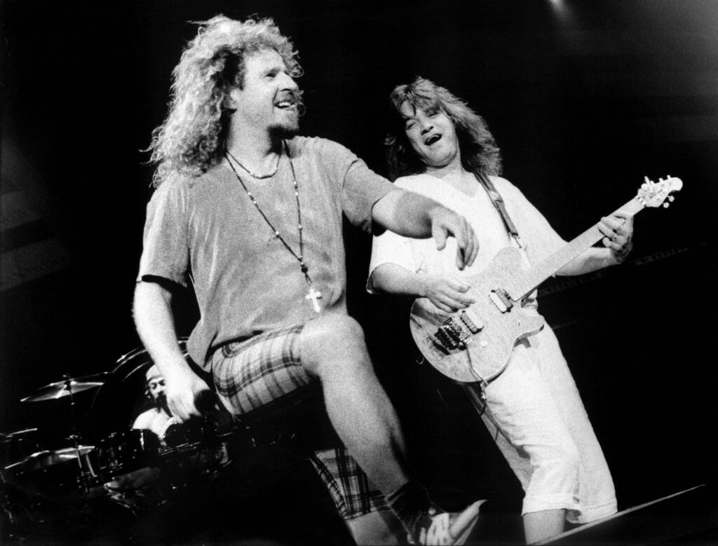 Sammy Hagar, Eddie Van Halen, and Alex Van Halen performing live on stage in 1995
